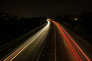 Fototapeta na wymiar Car light trails on a highway in night