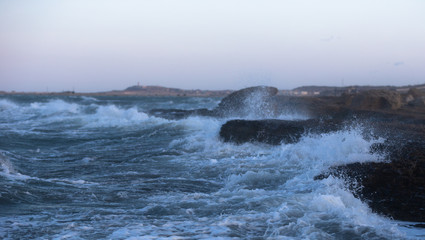 Waves crashing against rocks on Baku beach