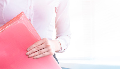 businesswoman with folder in hand