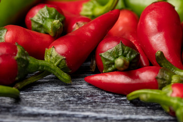 Group of Red hot chilli peppers close-up on a dark backgroundм
