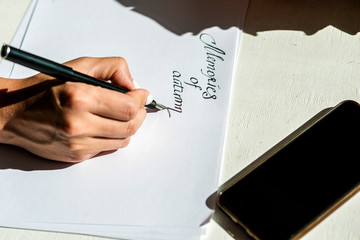 Handwritten text on a white sheet of paper.