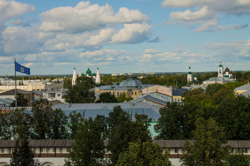 Fototapeta na wymiar panoramic view of the old city with historical architecture against a blue sky with white clouds on a clear summer day and space for copying in Yaroslavl Russia