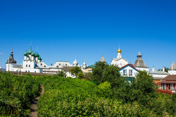 Fototapeta na wymiar panoramic view of the old city with historical architecture against the blue sky on a clear summer day and space for copying in Rostov Yaroslavl region Russia