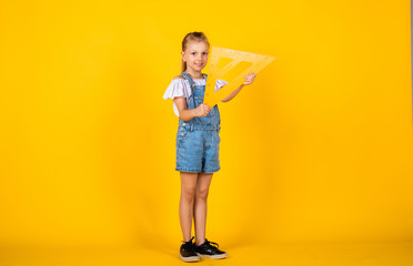 Education and school concept. small girl with triangle ruler. Math science concept with school...