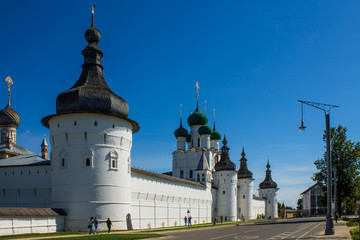 Fototapeta na wymiar historic white stone Kremlin with a temple and a fortress wall on a clear summer day against a blue sky and space for copying in Rostov Russia
