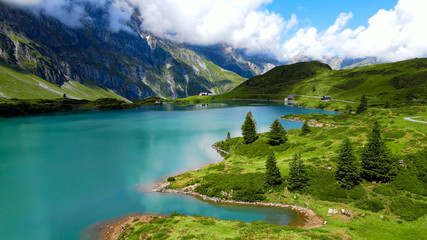 Fototapeta na wymiar Flight over a wonderful mountain lake in the Swiss Alps - Lake Truebsee on Mount Titlis - travel photography