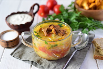 Mushroom soup in a glass dish on a white table