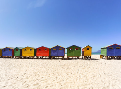 Colorful beach houses on the beach of Muizenberg in a long row - South Africa, Eastern Cape