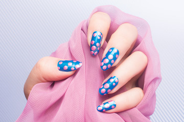 pink spotted blue nails manicure