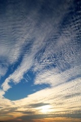 gorgeous sunset with cotton-like polka dot blur clouds