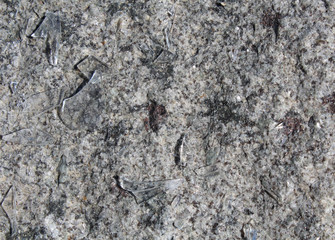 Broken glass on a granite slab.