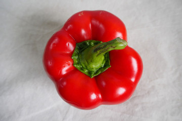 close up red large sweet pepper top view on grey background . red vegetables