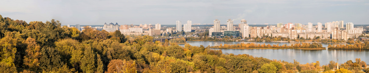 Naklejka premium Kiev, Ukraine, autumn panoramic view of the slopes of the Dnieper, the Dnieper river and various buildings on the river bank