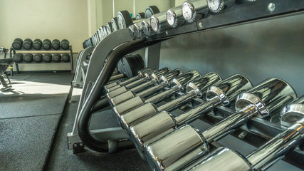 The dumbbells at the fitness center lie in the general closet