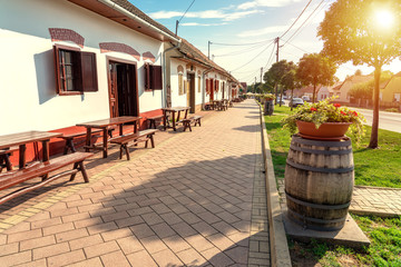cityscape of Villany Hungary with barrels and cellers on the walking street