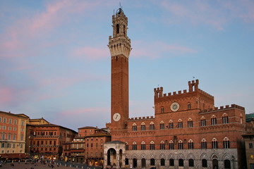 Fototapeta premium The Palazzo Pubblico (town hall) is a palace in Siena. Construction was started in 1297. Torre del Mangia, was built between 1325 and 1344, Italy