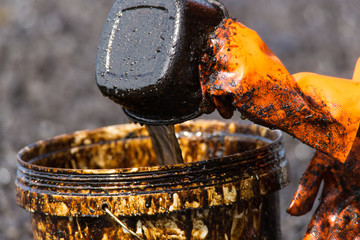 Volunteers clean the ocean coast from oil after a tanker wreck. Mauritius
