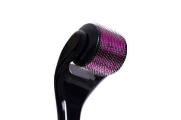 Derma roller isolated on a white background.