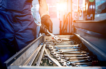 Tools at the hands. Auto repair service