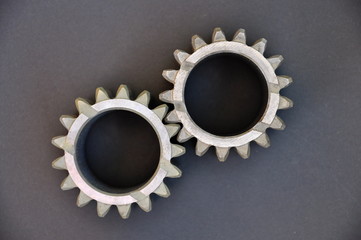 metal cogs cogwheels on a dark background.