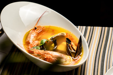 Bouillabaisse fish soup with prawns, mussels, tomato ,lobster and squid. Traditional in France,...