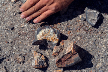 Pieces of semi precious gemstones druses on the ground Selective focus