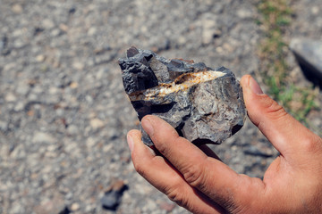 Pieces of semi precious gemstones druses on the ground Selective focus