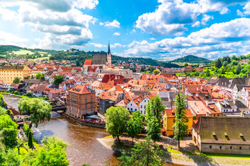 Panoramic view of Cesky Krumlov with St Vitus church in the middle of historical city centre. Cesky...
