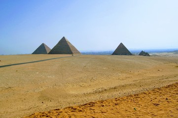 Fototapeta na wymiar Mystical pyramids in the ruins of Giza, Egypt, Africa