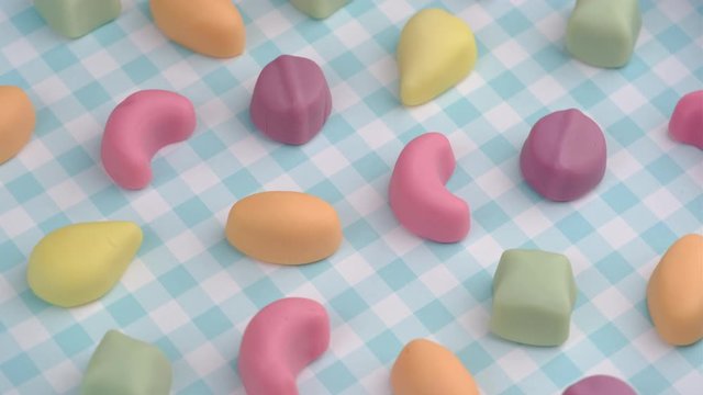 Candy sweets background. Assorted colorful gummy candies. Pastel color palette delicious jelly sweets turning.