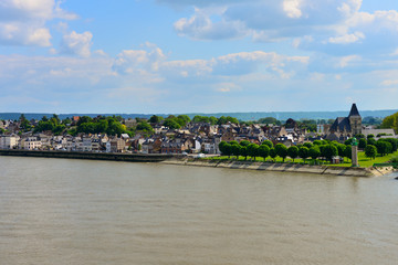 Obraz premium Beautiful French village with old historical building. View from the Seine river.