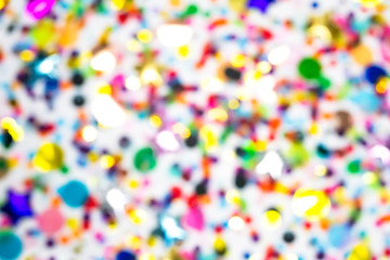 Colorful confetti defocused blur wallpaper. Party pattern, white background. luxury festive...