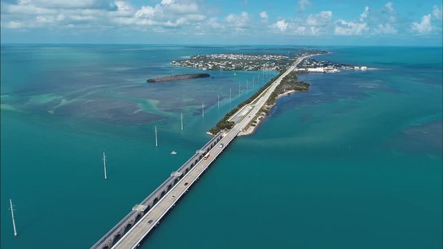 Key West: 7 Mile bridge, Florida Keys, United States. Aerial view of bridge and islands in the way to Key West, Florida, United States. Great seascape. Viaduct scene. Transportation view.