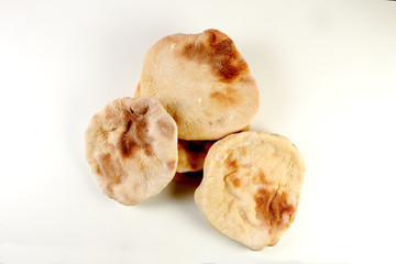 a pile of pita breads on a white background