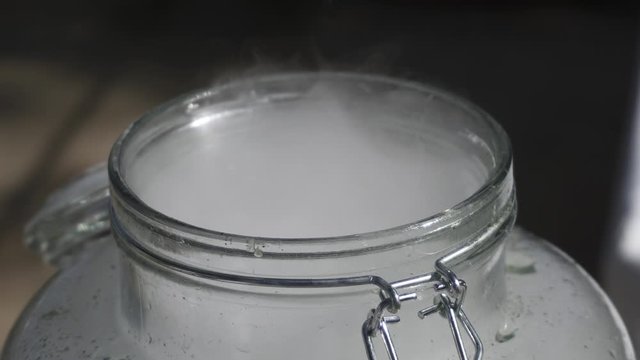 close up footage of liquid azote smoking in bottle for lemonade or cocktails