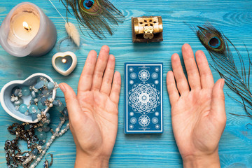 Fortune teller with a tarot cards in hands.