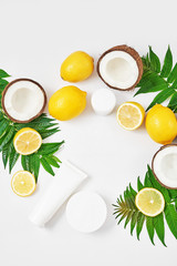 Natural organic homemade cosmetics with lemon and coconut. Skin care. Spa salon and treatments. Beautician background. Clay, lemon, beauty products.Tropical summer concept. Flat lay, copy space