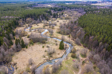 Fototapeta na wymiar Drone shot flying on spring river in forest