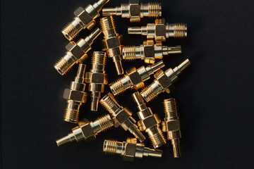 High-frequency SMA connectors isolated on black background.