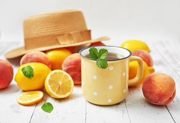 Fruit lemons and peaches on white background. Summer postcard. Hello summer! Harvesting. Healthy food and nutrition. Fruit background. Healthy cozy breakfast. Natural organic products. Vitamins