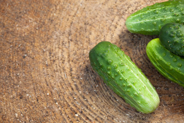 Cucumber on the wood textured background
