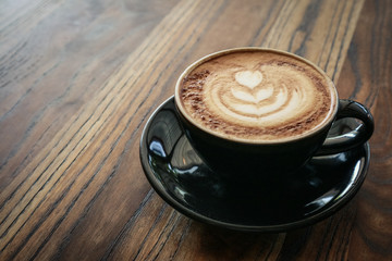 A cup of coffee with latte art on top
