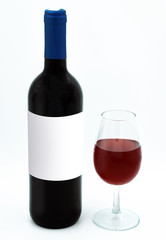 A wine bottle mockup with glass of red