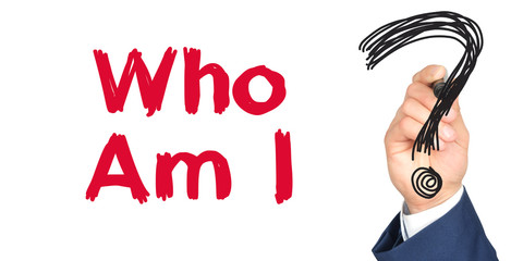 Hand with marker writing: Who Am I