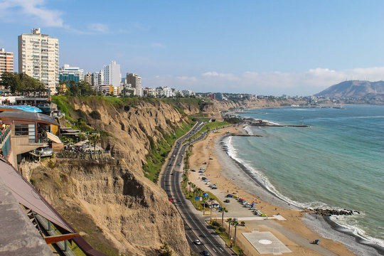 Green Coast in Lima Peru. Horizon, sea and sun.
