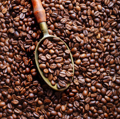 heap of coffee beans with spoon