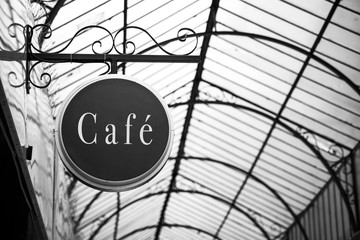 closeup of traditional signboard of french cafe in a retro gallery 1900