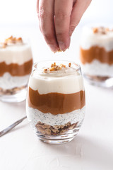 Yogurt with chia, peanut cream and nuts jars.