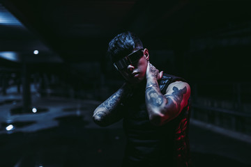 Night portrait of a man in futuristic glasses. A new trend of cyberpunk. © callisto