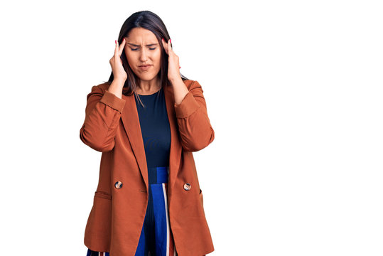 Young beautiful brunette woman wearing elegant clothes with hand on head for pain in head because stress. suffering migraine.